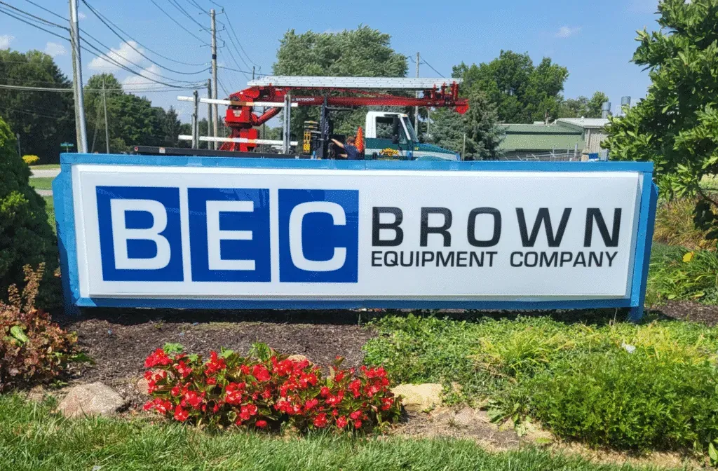 BEC Brown Equipment Company signage with landscaping and equipment in the background.