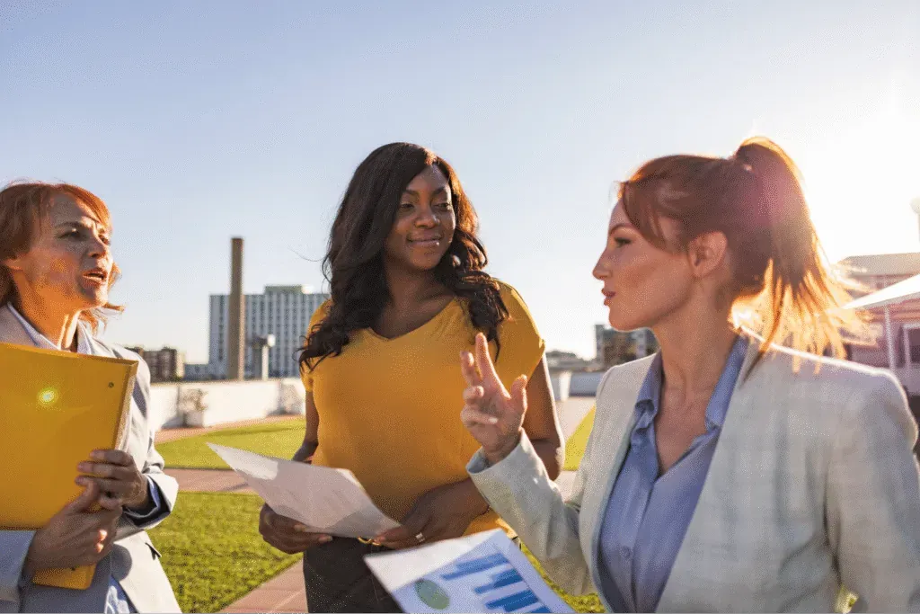 Women engaging in fleet management discussion.