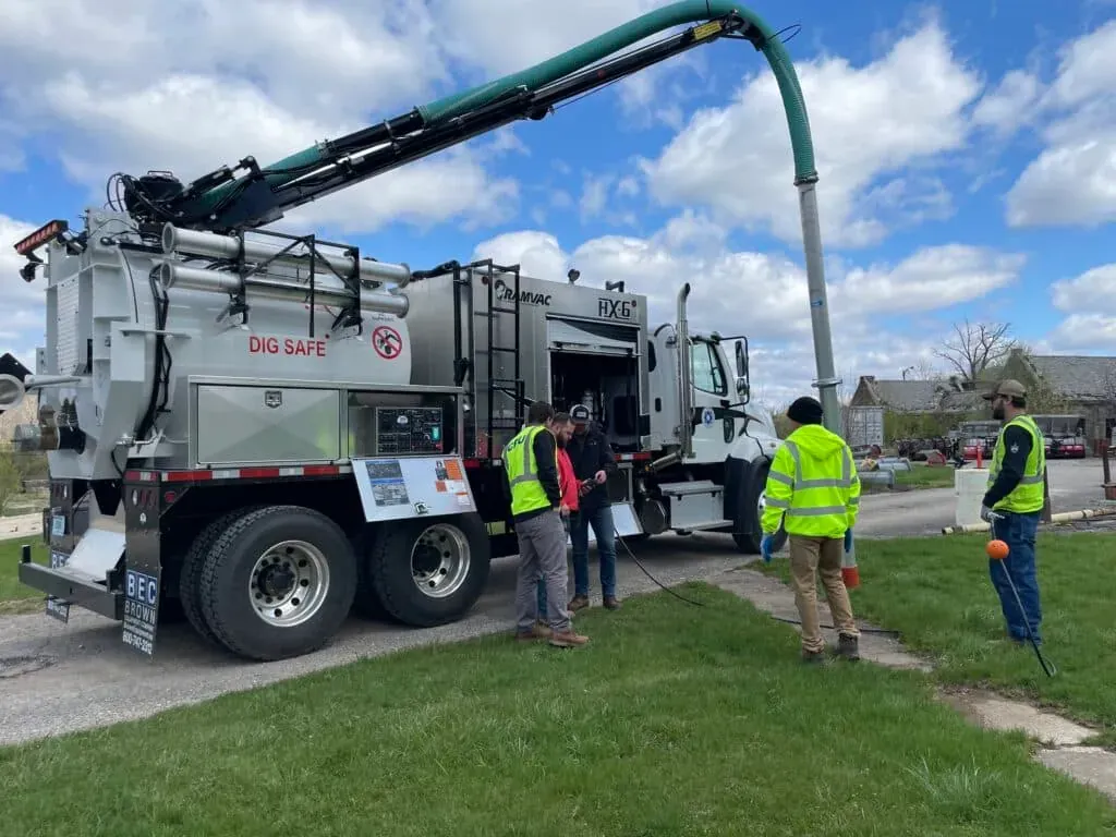 Dig safe truck in use, demonstrating safety practices in sewer line repair work.