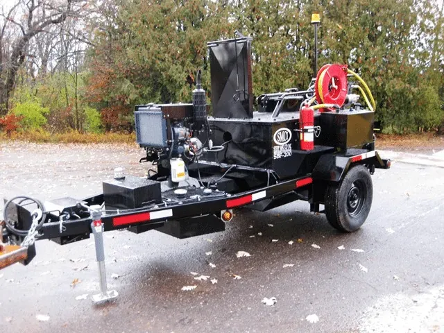 Asphalt equipment for various outdoor tasks and projects with Fall leaves on the ground.