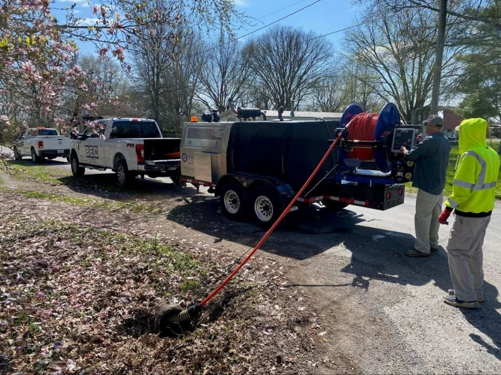 Local road maintenance crew using a Mongoose Jetter for excavation work.