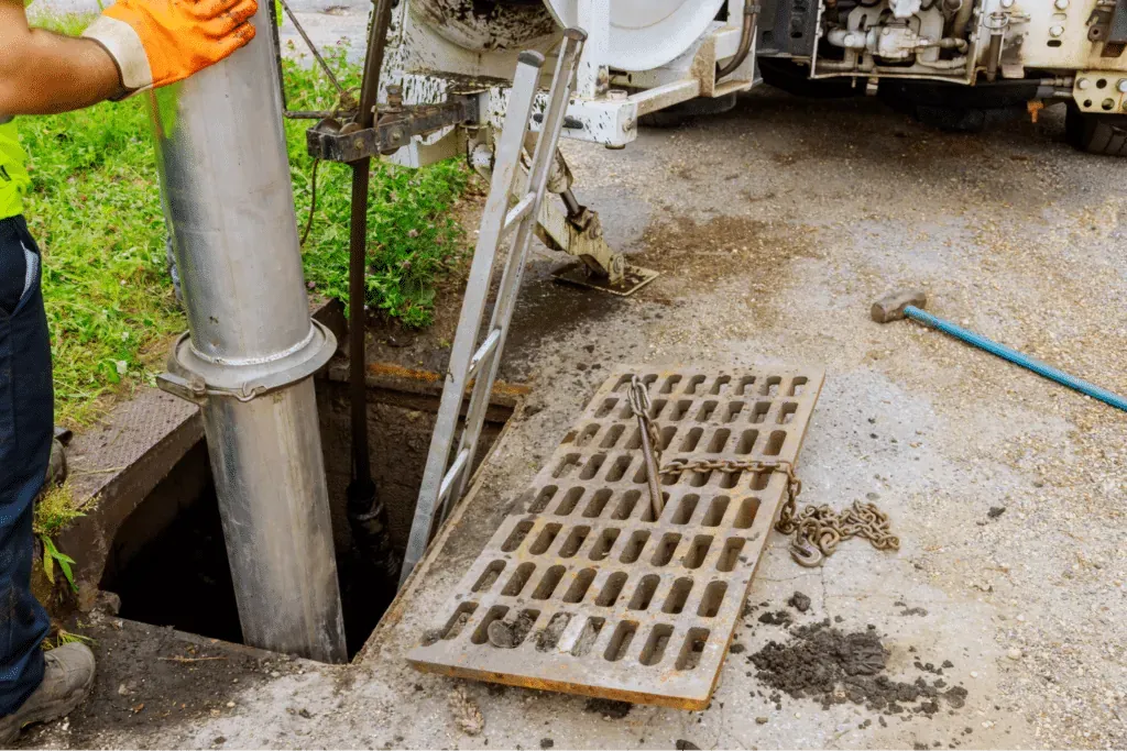 Sewer cleaning professionals removing debris and maintaining drainage systems.