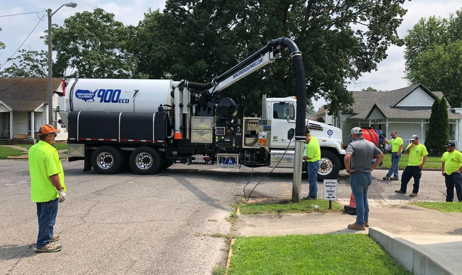 Sewer Equipment 900 ECO combination sewer truck set up at a manhole with its vacuum boom extended.